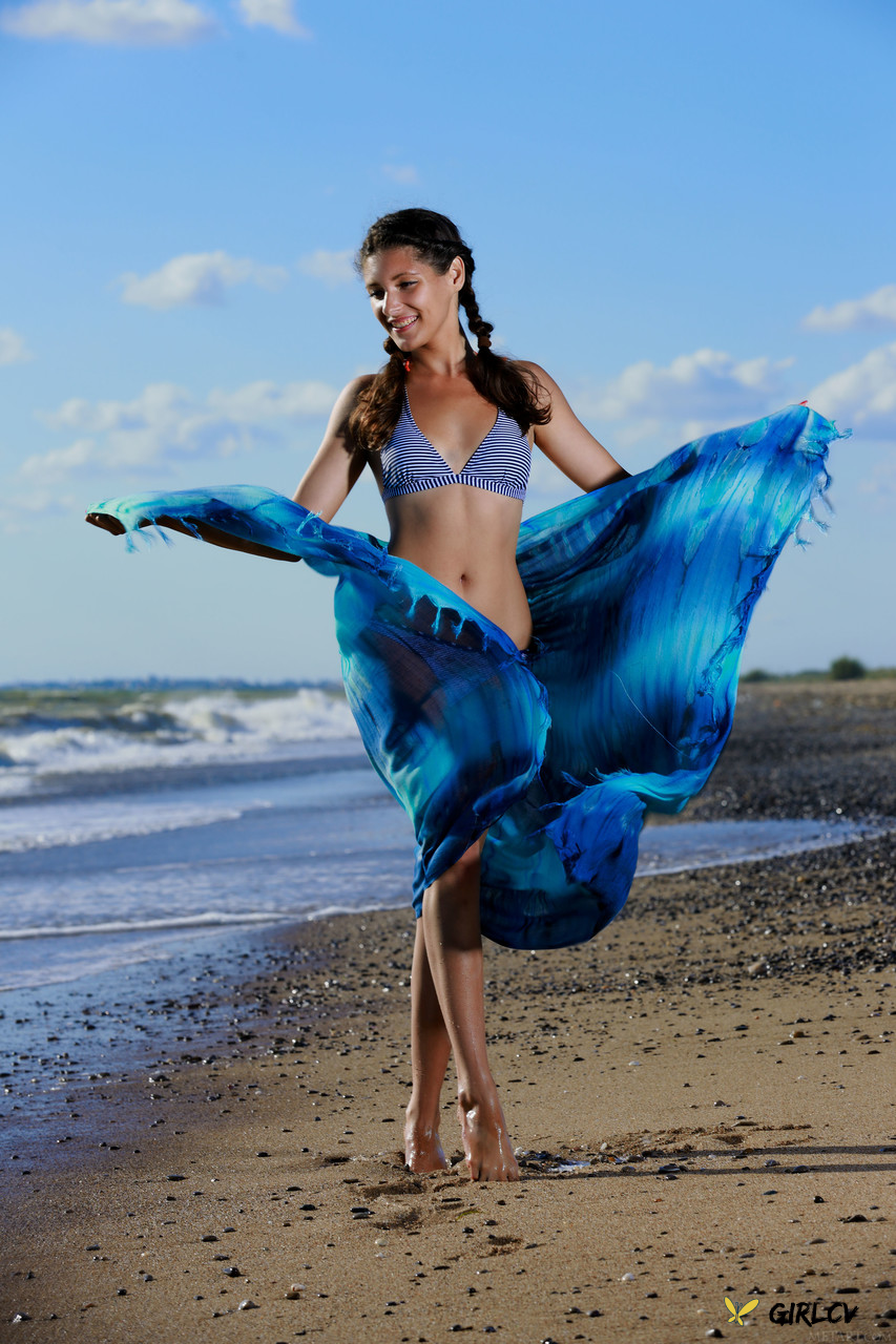 beautiful babe rosella stripping and touching herself on the sandy beach