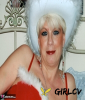 mature amateur dimonty models sexy lingerie during a christmas shoot