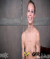 tattooed girl kassie kay is tied to a chair before a man and woman abase her178521