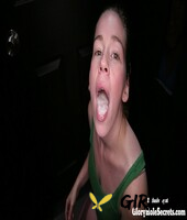 clothed redhead chick shows off a mouthful of cum after a gloryhole blowjob143361