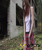schoolgirl anya takes a pee out back of an abandoned building during the day129407