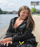 beautiful brunette shows her small tits and her shaved pussy on her bed