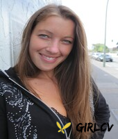 beautiful brunette shows her small tits and her shaved pussy on her bed