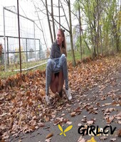 white girl claudia macc takes a piss on fallen leaves near a sports park 70061399136347