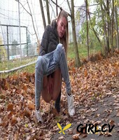 white girl claudia macc takes a piss on fallen leaves near a sports park 70061399136348
