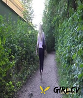 blonde girl delphine takes a pee on a dirt path near some greenery147783