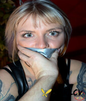inked blonde roxxxi manson is quieted with duct tape while bound in leather162485