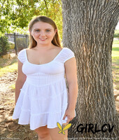 amateur model zoey toys her pussy while showing her big tits in a yard