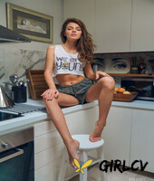 sweet teen with a slim figure kalisy undresses and poses naked in the kitchen