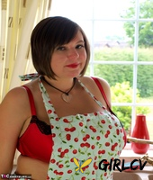 fat amateur roxy bares her huge tits in pretties and a kitchen apron