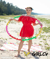 charming young girl nesti gets naked on a towel upon a somewhat sandy beach118625