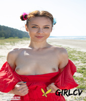 charming young girl nesti gets naked on a towel upon a somewhat sandy beach118626