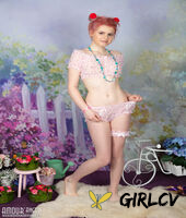 young looking girl sally gets naked while wearing a garter in puffballs137093