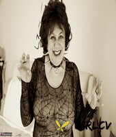 mature lady masturbates with a chicken foot while decked out for halloween238417