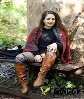lovely chubby doll with curly hair lili toying herself in nature