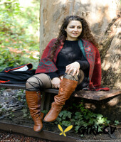 lovely chubby doll with curly hair lili toying herself in nature