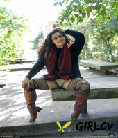 lovely chubby doll with curly hair lili toying herself in nature