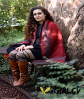 lovely chubby doll with curly hair lili toying herself in nature