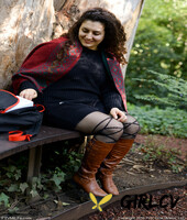 lovely chubby doll with curly hair lili toying herself in nature