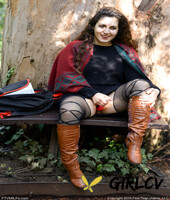 lovely chubby doll with curly hair lili toying herself in nature