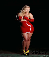 glamorous blonde ancilla tilia takes off her red latex dress and poses topless