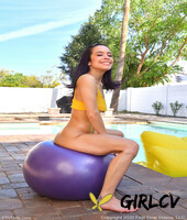 thin amateur lana bounces atop a dildo ball on a poolside patio
