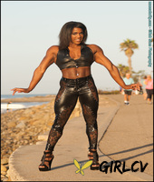 black bodybuilder jaquita person taylor flexes outside in black leather attire92879