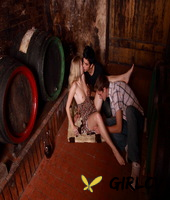 young blonde has sex with a couple of boys while they drink wine in a cellar