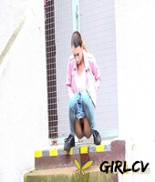 young girl adele unicorn pulls down blue jeans to pee on a set of public steps140235