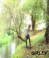 blonde girl claudia macc gets caught taking a pee next to a body of water126464