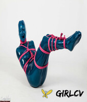 fetish model ropemarks is encased in latex clothing while bound with pink rope 90511567