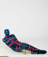 fetish model ropemarks is encased in latex clothing while bound with pink rope 90511567189196