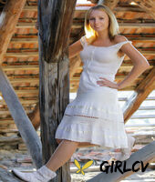 young blonde ilona d gets naked in a rustic setting with her boots on