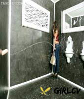 sultry brunette gets covered with jizz via a hole in the bathroom wall