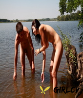 young couple have sexual intercourse in shallow water near the shore